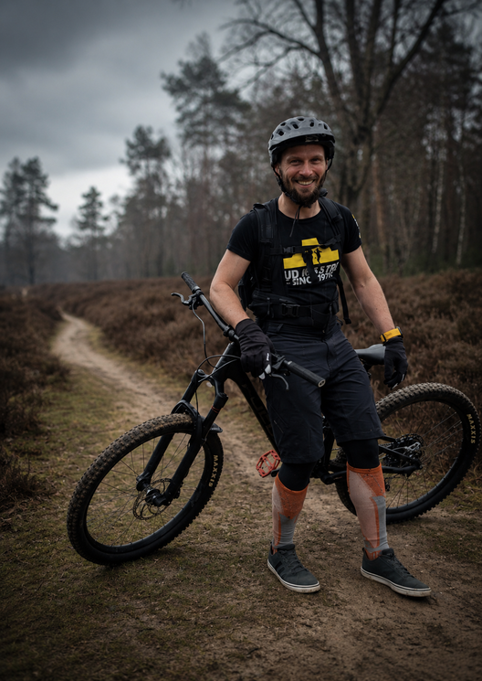 Łukasz, founder of Drais, on a heathland trail